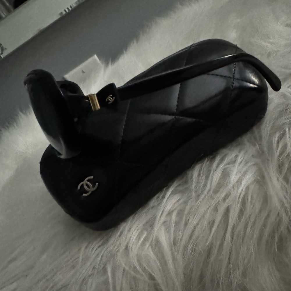 Authentic Chanel Black Sunglasses with black bows on side. Case included.